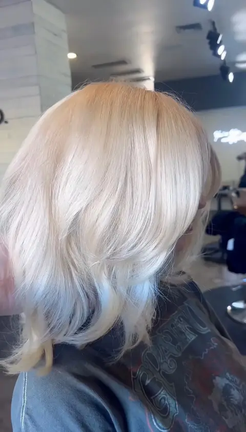 Platinum blonde with cool-tone finish — high-lift bleach and tone by Rachel Charles, Phoenix.