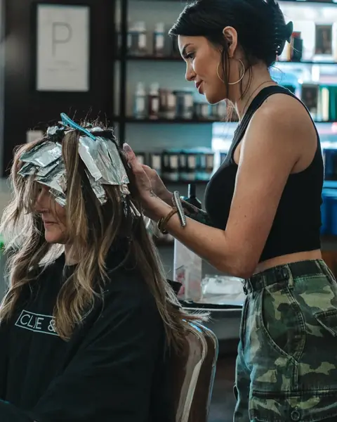 Custom foil work — precision foil placement for high-impact dimensional highlights. Phoenix balayage and foil specialist Rachel Charles.