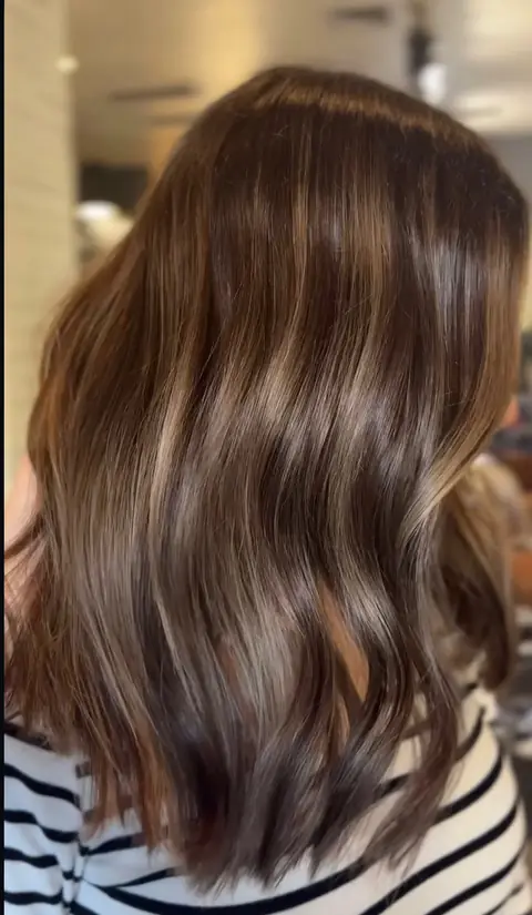 Dimensional brunette color with subtle face-frame brightness — Phoenix hair colorist Rachel Charles.